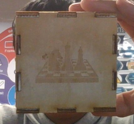 Cube face engraved with chess pieces