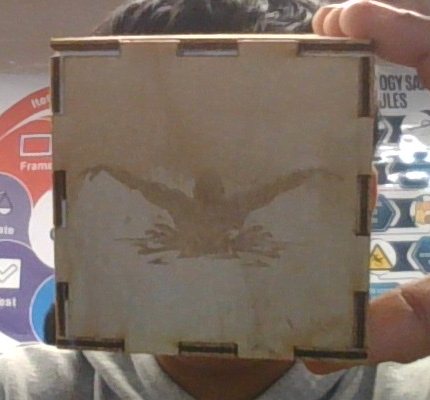 Cube face engraved with a swimmer